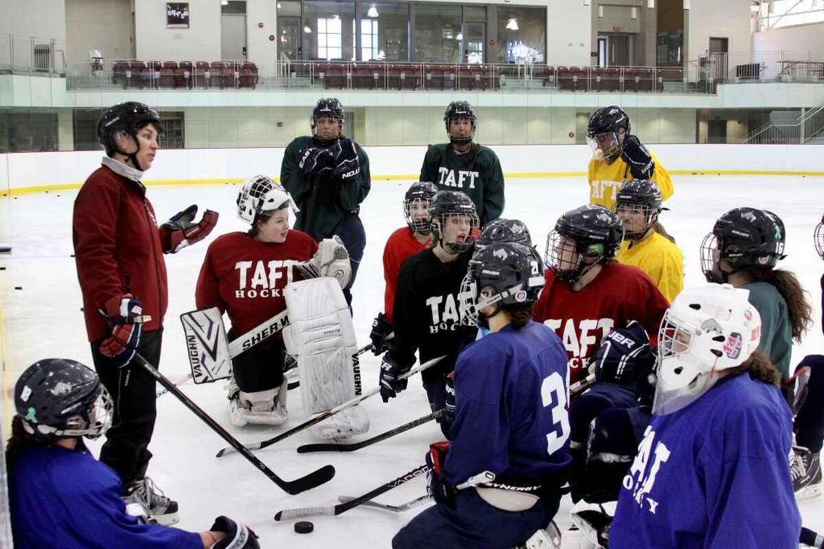 Gretchen Silverman working with the girls' hockey team at The Taft School in Watertown.