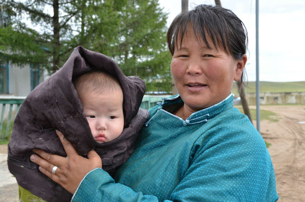 A mother with a newborn baby leaving the hospital in Mongolia.