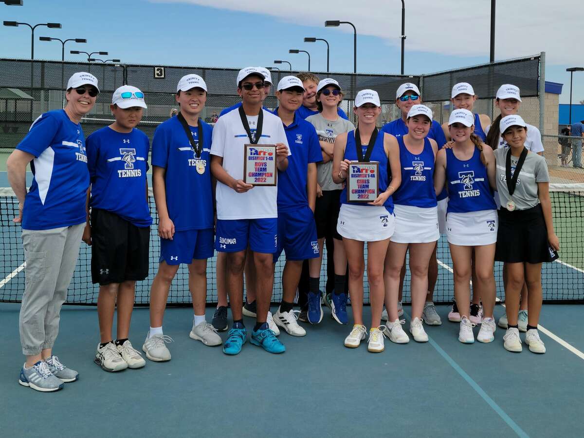 The Trinity tennis teams pose after winning TAPPS 1-4A district boys and girls titles at Bush Tennis Center on 3/29/2022