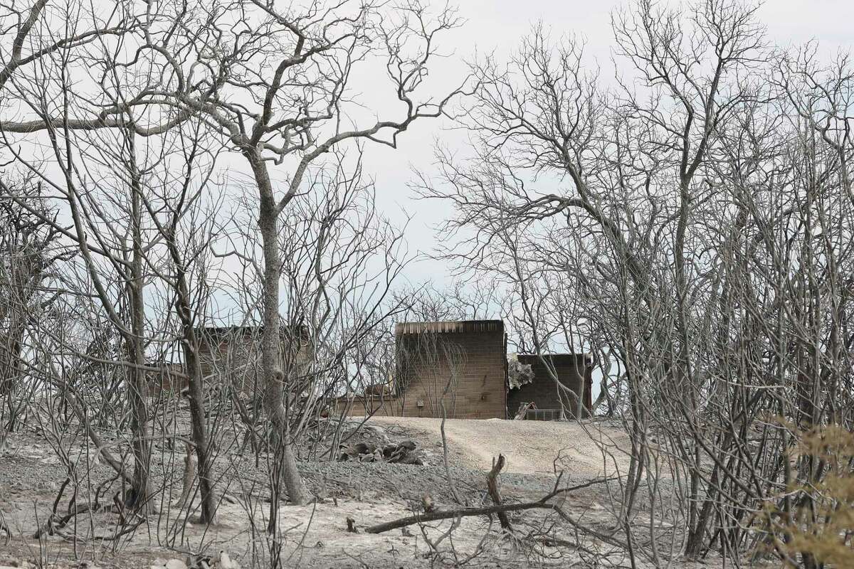 A destroyed home is seen during a March 29, 2022, tour of the High Mountain Ranch subdivision after the Das Goat fire swept through the Medina County neighborhood.
