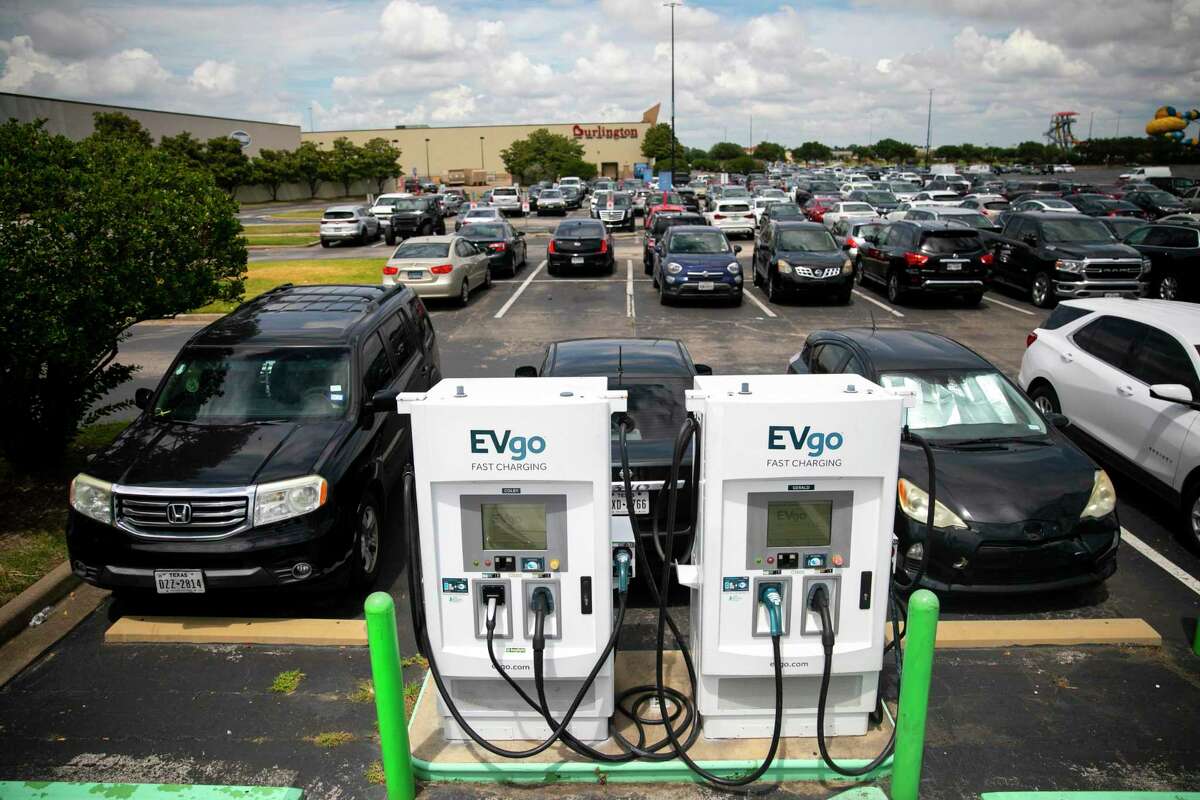 Two charging stations sit in the parking lot outside H&M at Katy Mills Mall on Aug. 29, 2021. A new report estimates the Houston region could reap $33.4 billion in health benefits if all vehicles shift to zero-emission power sources.