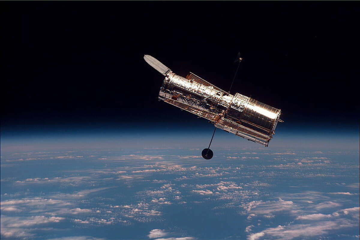 The Hubble Space Telescope (HST) begins its separation from Space Shuttle Discovery following its release on mission STS-82. February 1997.