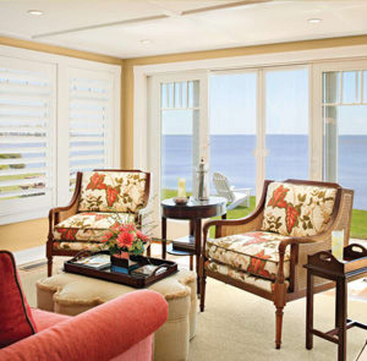 Poulin opened the back wall of thehouse to the sea, creating the stunning view that defines the space. To further enhance the effect she chose low-backed couches and chairs that would not obstruct the view.