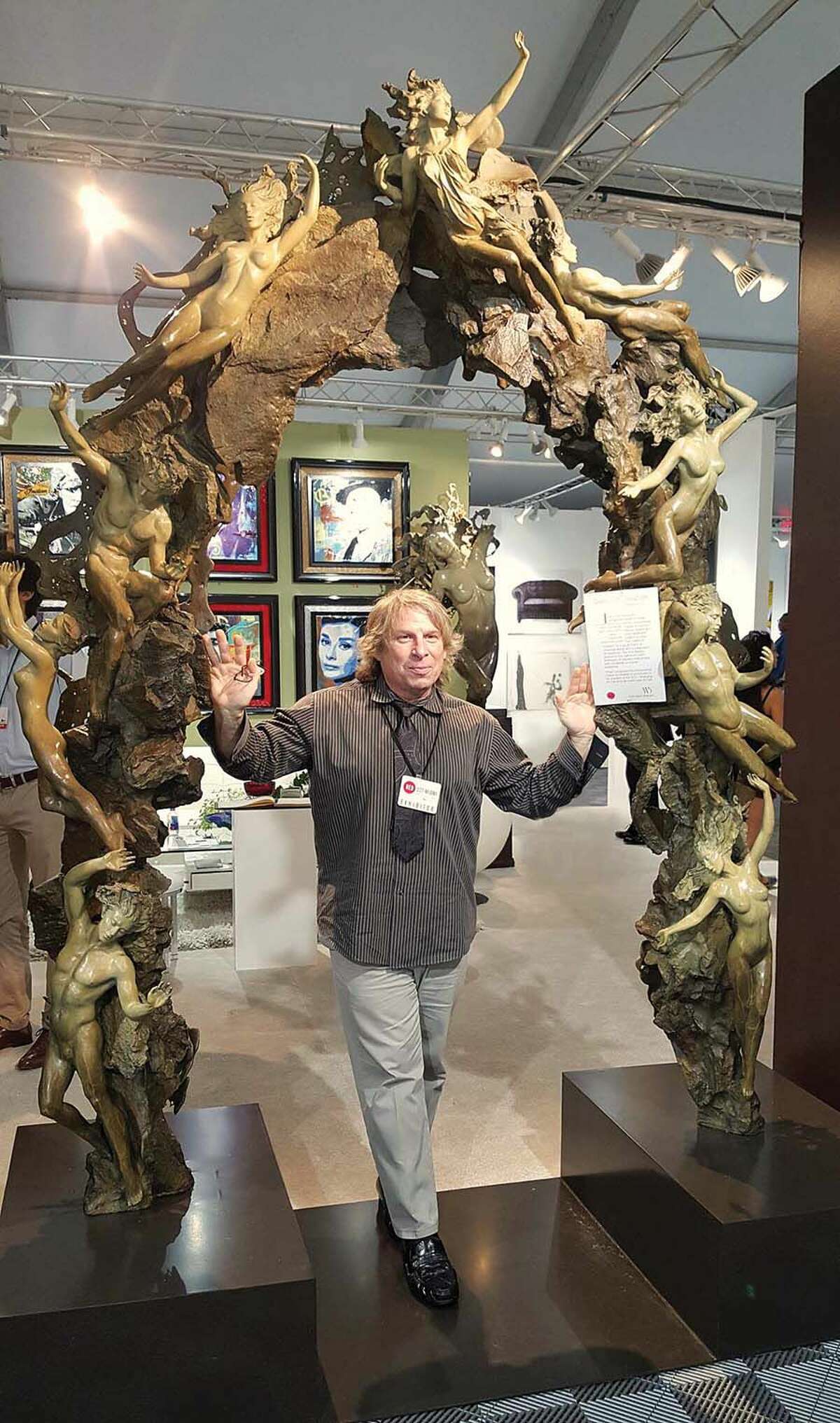 Ira Reins with his newest sculpture, Gates of Creation. 