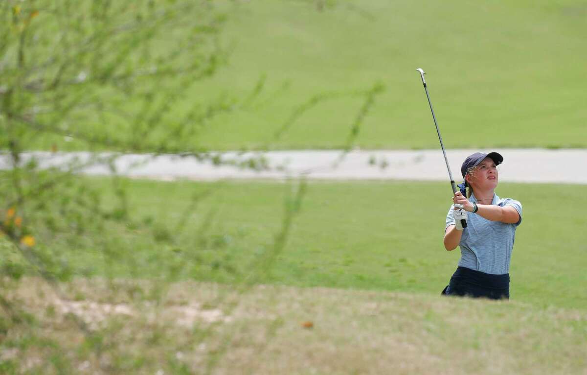Katya Tibbetts of Lake Creek hits onto the 9th green during the District 20-5A golf tournament, Tuesday, March 29, 2022, in Magnolia.
