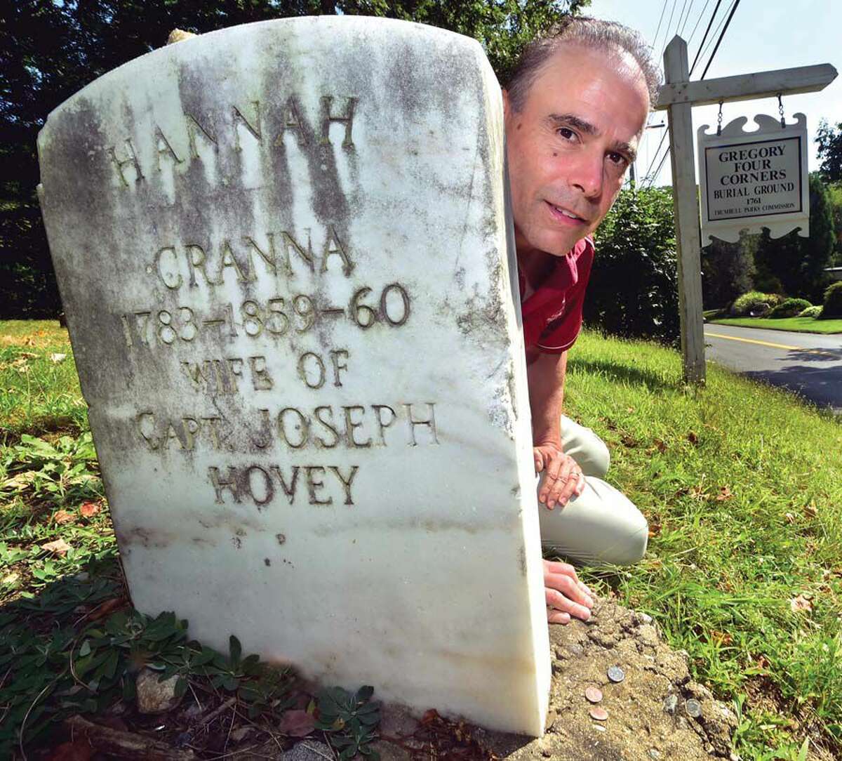 Lennie Grimaldi, author of Connecticut Characters: Personalities Spicing Up the Nutmeg State, at the gravesite of a “witch” named Hannah Cranna at Gregory’s Four Corners Burial Ground on Spring Hill Road in Trumbull. Cranna placed a curse on Monroe, according to legend.