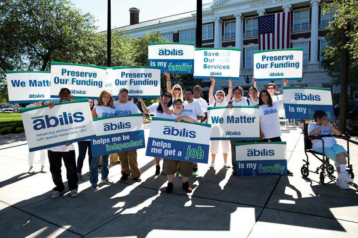 Members of Abilis rallied outside Greenwich Town Hall this summer to oppose funding cuts.