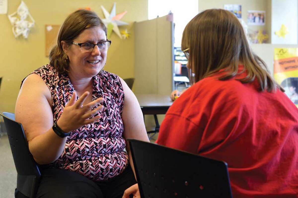 Kelly Dorsey, left, works for and receives services from Meriden’s MidState Arc, a nonprofit that helps the developmentally disabled gain skills to live independently. 