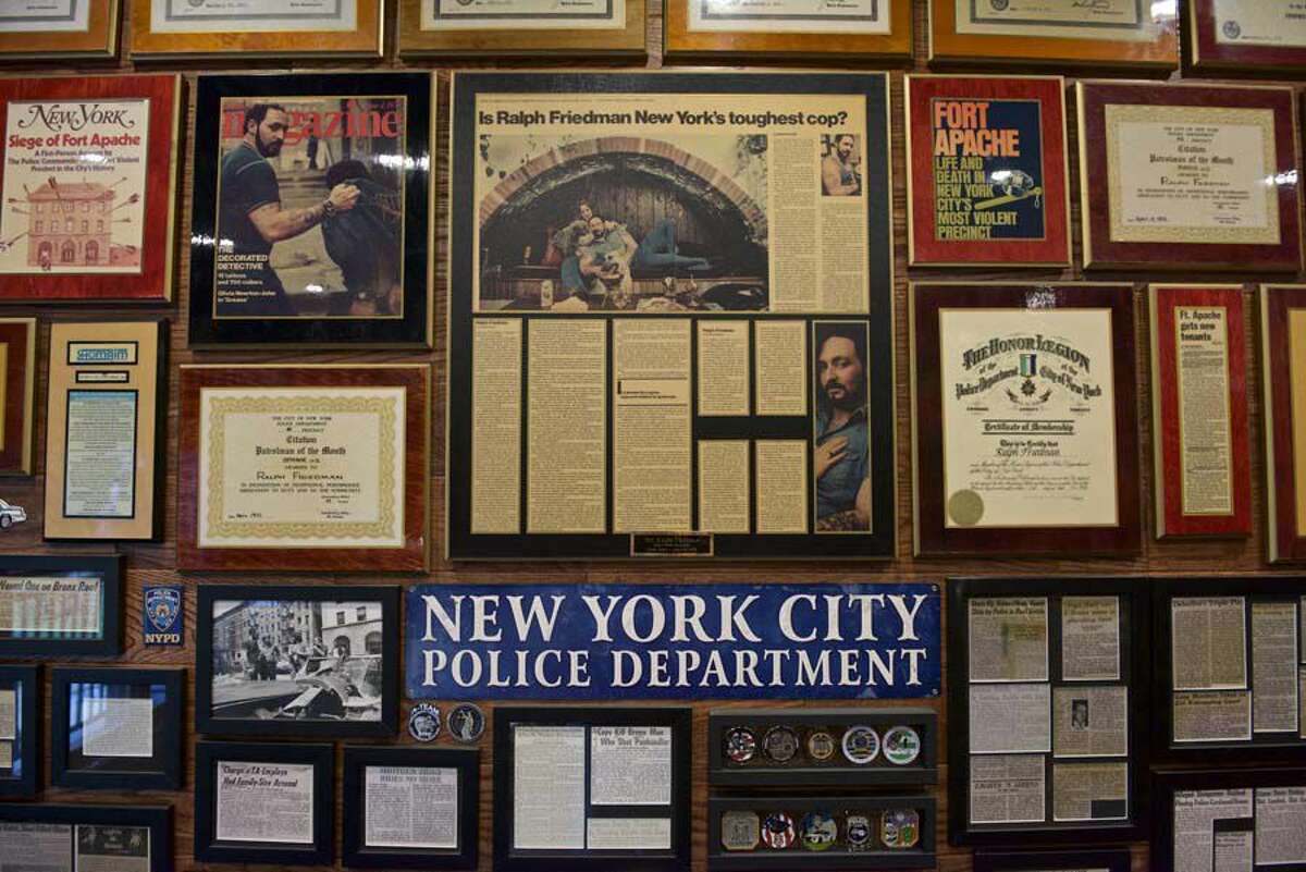 Awards, citations, letters and news stories cover the walls of former New York City Police Department detective Ralph Friedman's study.