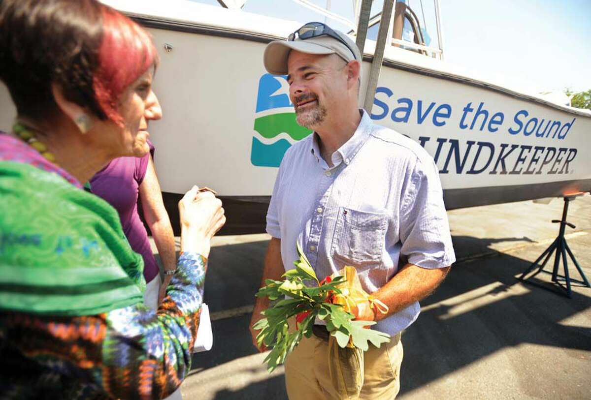 U.S. Rep. Rosa DeLauro, left, chats with new Soundkeeper Bill Lucey at a ceremony which both introduced him and christened his new boat at Brewer Marina in Stratford. 