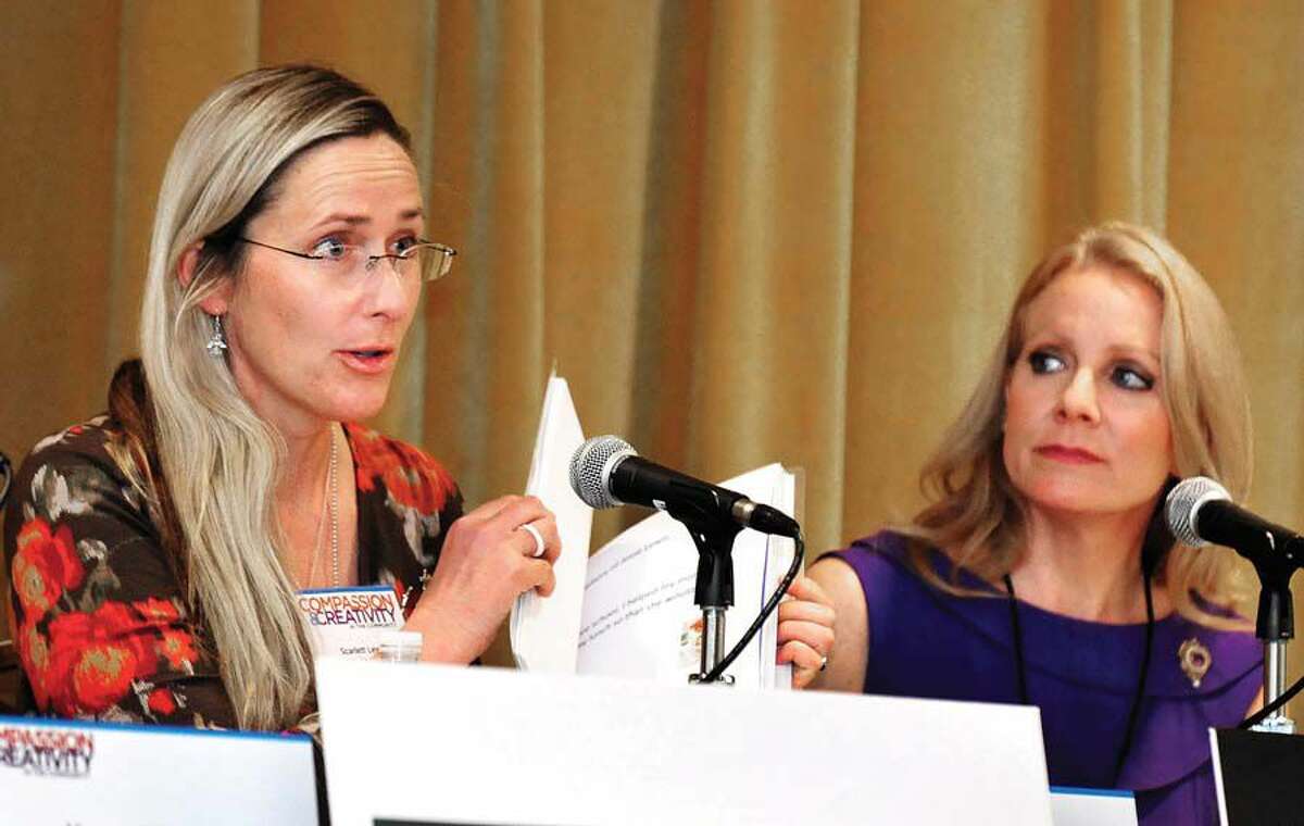 Scarlett Lewis, mother of Sandy Hook shooting victim Jesse Lewis, speaks during a conference on Compassion & Creativity in the Community, held at the Portuguese Cultural Center in Danbury, Conn. Saturday, April 13, 2013. Panel moderator Casey Jordan listens, right.