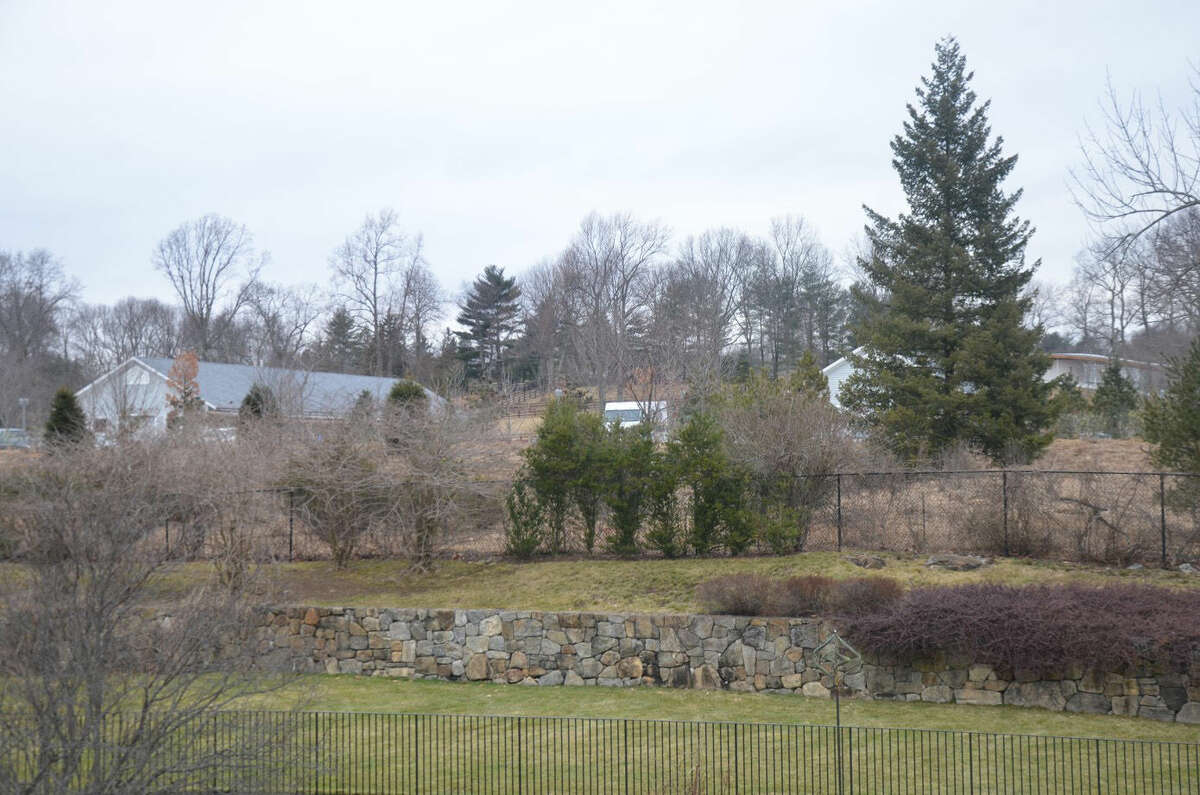 Grace Farms' parking lot is visible from the New Canaan property of Paul and Danita Ostling.