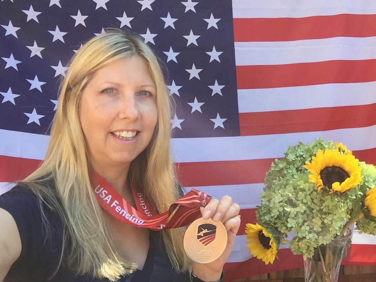 Sandra Marchant shows off her medal from the 2016 national championships in Texas.