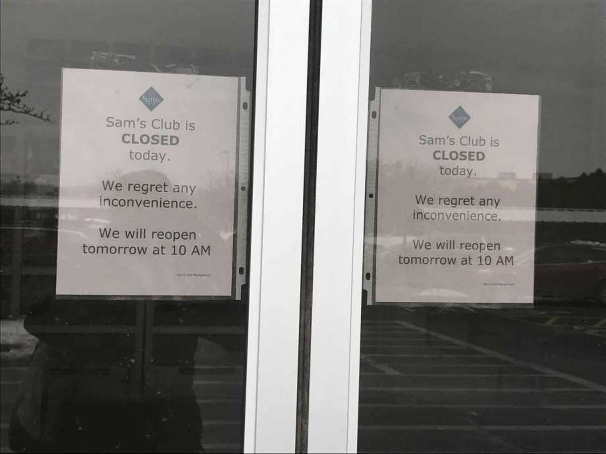 A sign on the door of the Orange Sam’s Club on Thursday.