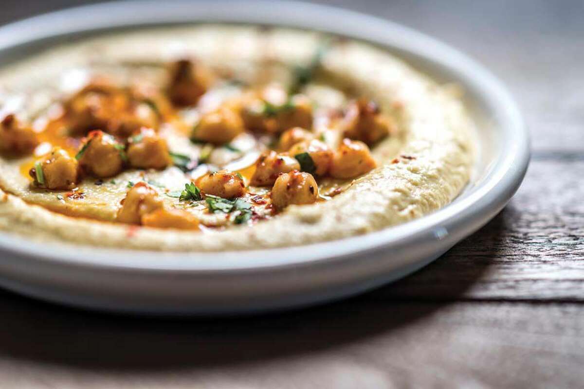 The market hummus, a Zohara specialty, is made with locally foraged or farmed toppings and served with freshly baked pita.