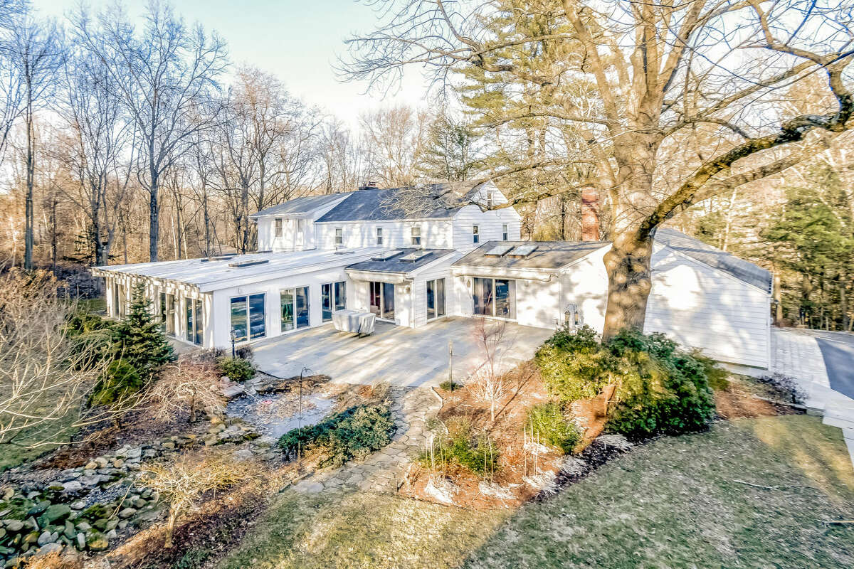 An indoor swimming pool, ensconced in a 2,000 square-foot room, is the focal point of the spacious Colonial at 180 Strobel Road in Trumbull. The 4,696-square-foot four bedroom, three and a half bath house sits on an acre of property overlooking a waterfall and pond. Originally built in 1963, it has been completely renovated and updated.