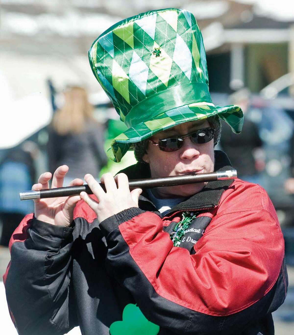 Wendy Weiss, of New Milford, plays the fife for the Connecticut Rebels at the Greater Danbury Irish Cultural Center's St. Patrick's Day parade on Main Street in Danbury. Sunday, March 19, 2017