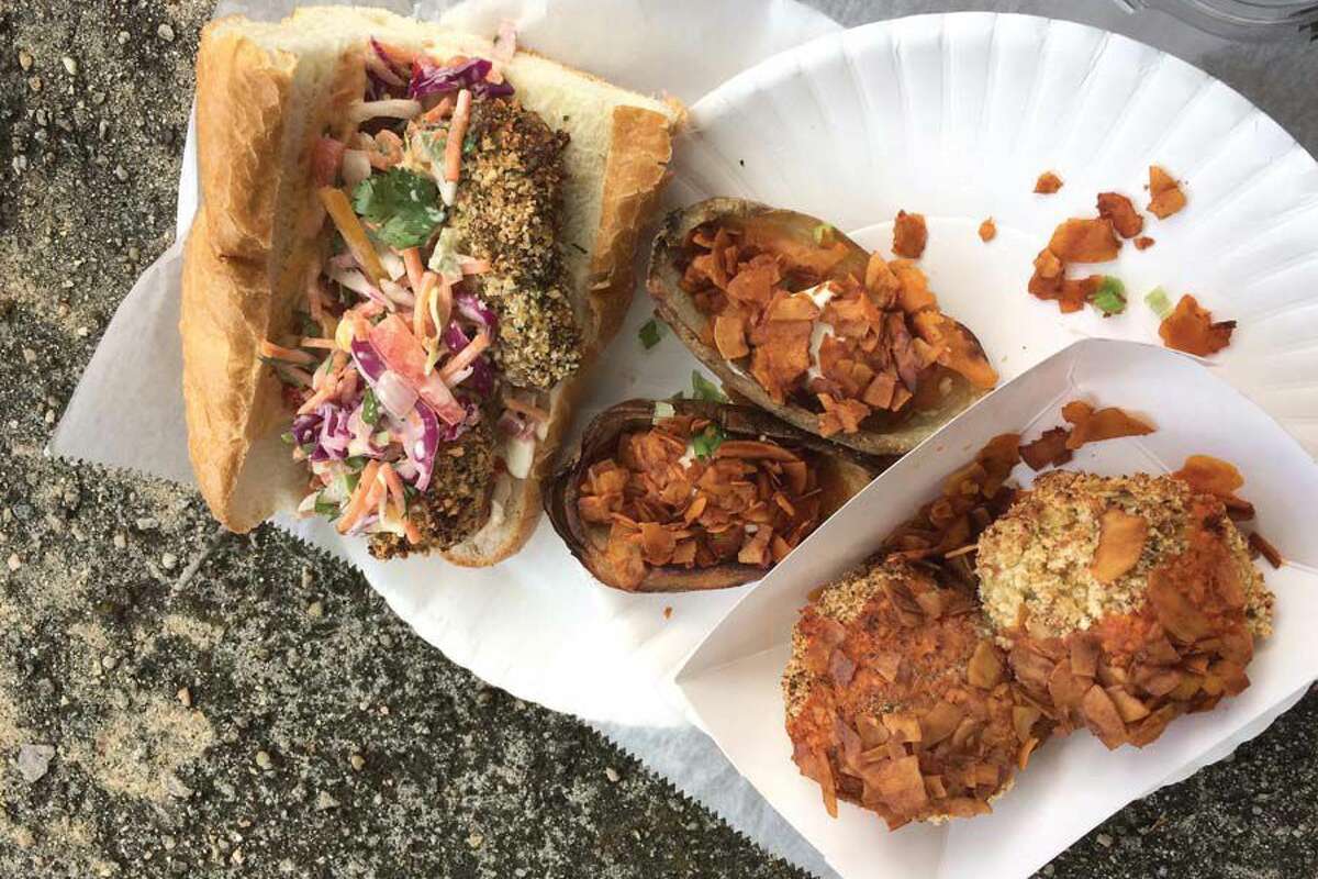 From left, hot Italian 'sausage' and pepper sub, potato skins with 'cheddar, sour cream & bacon' and mac n' cheese balls topped with 'bacon,' from Three Girls Vegan Creamery in Guilford.