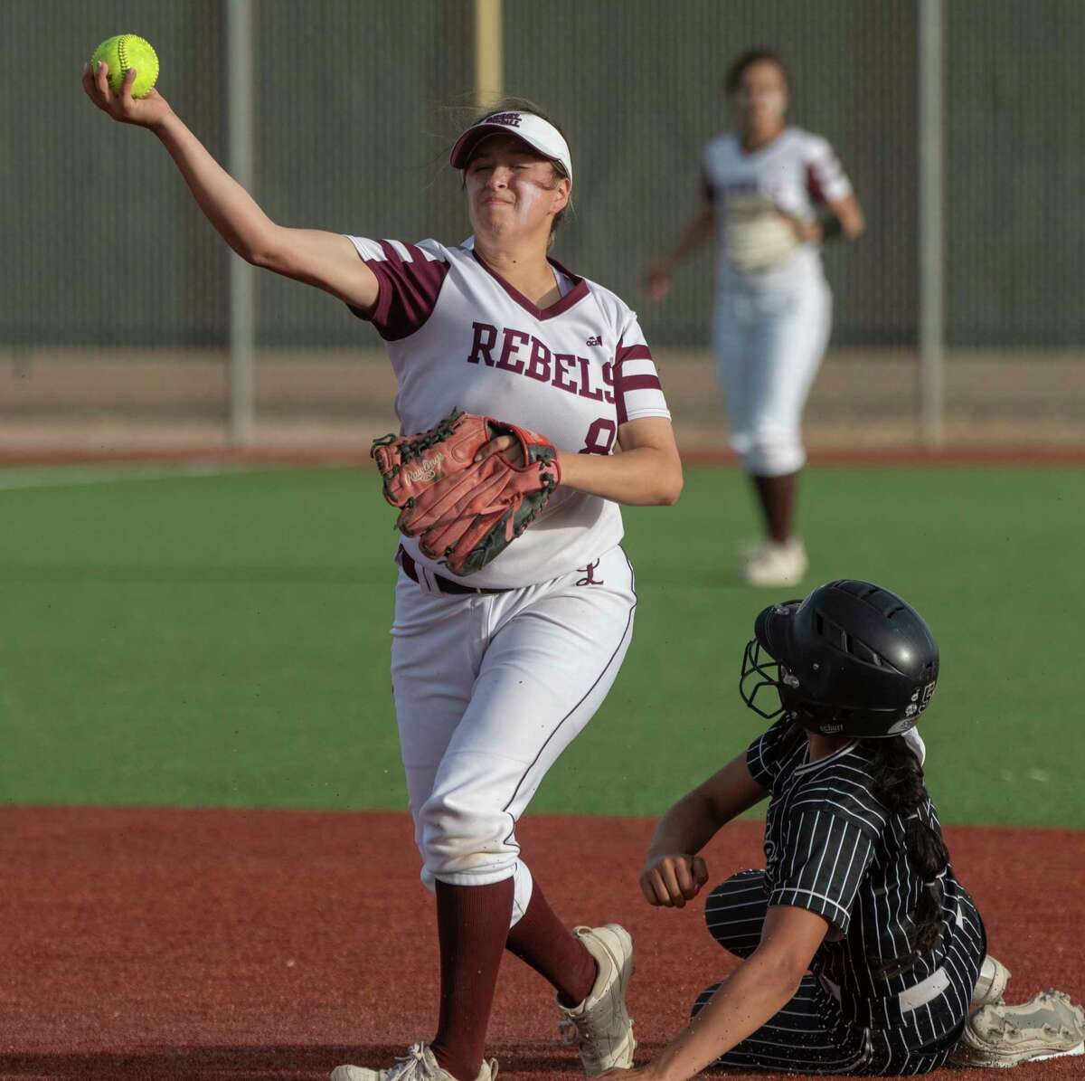 Legacy High's Alfa Laredo gets the force out at second on Permian's Madison Garcia, but pulls back her throw to first 03/29/2022 at Gene Smith Field. Tim Fischer/Reporter-Telegram