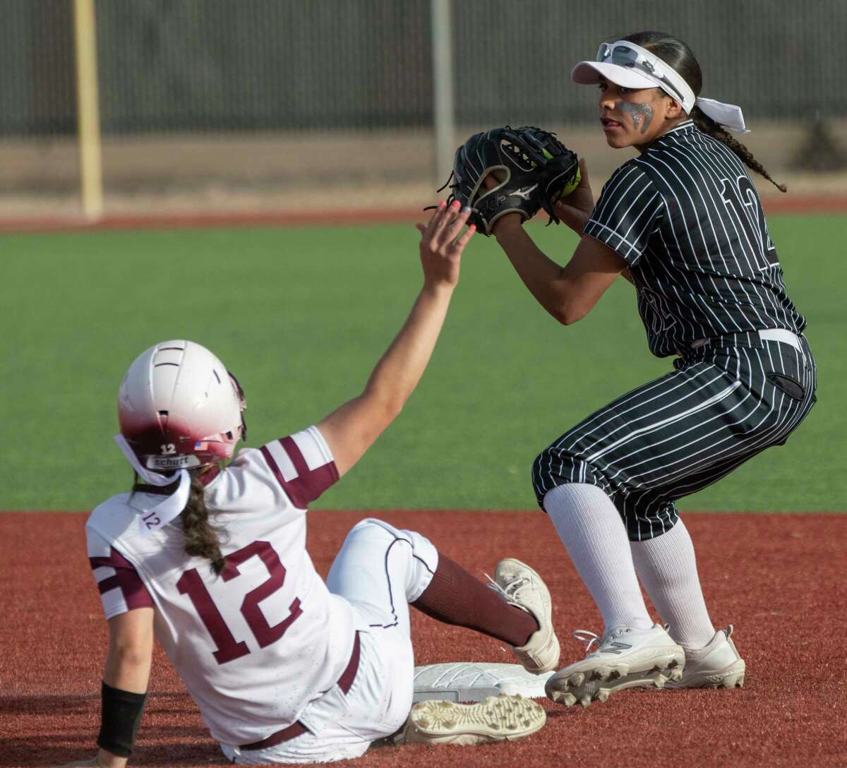 Legacy High's Jaycie Pacheco is out at second but tries to disrupt the throw as Permian's Anyssa Cruz looks to throw to first but does not make the double play 03/29/2022 at Gene Smith Field. Tim Fischer/Reporter-Telegram