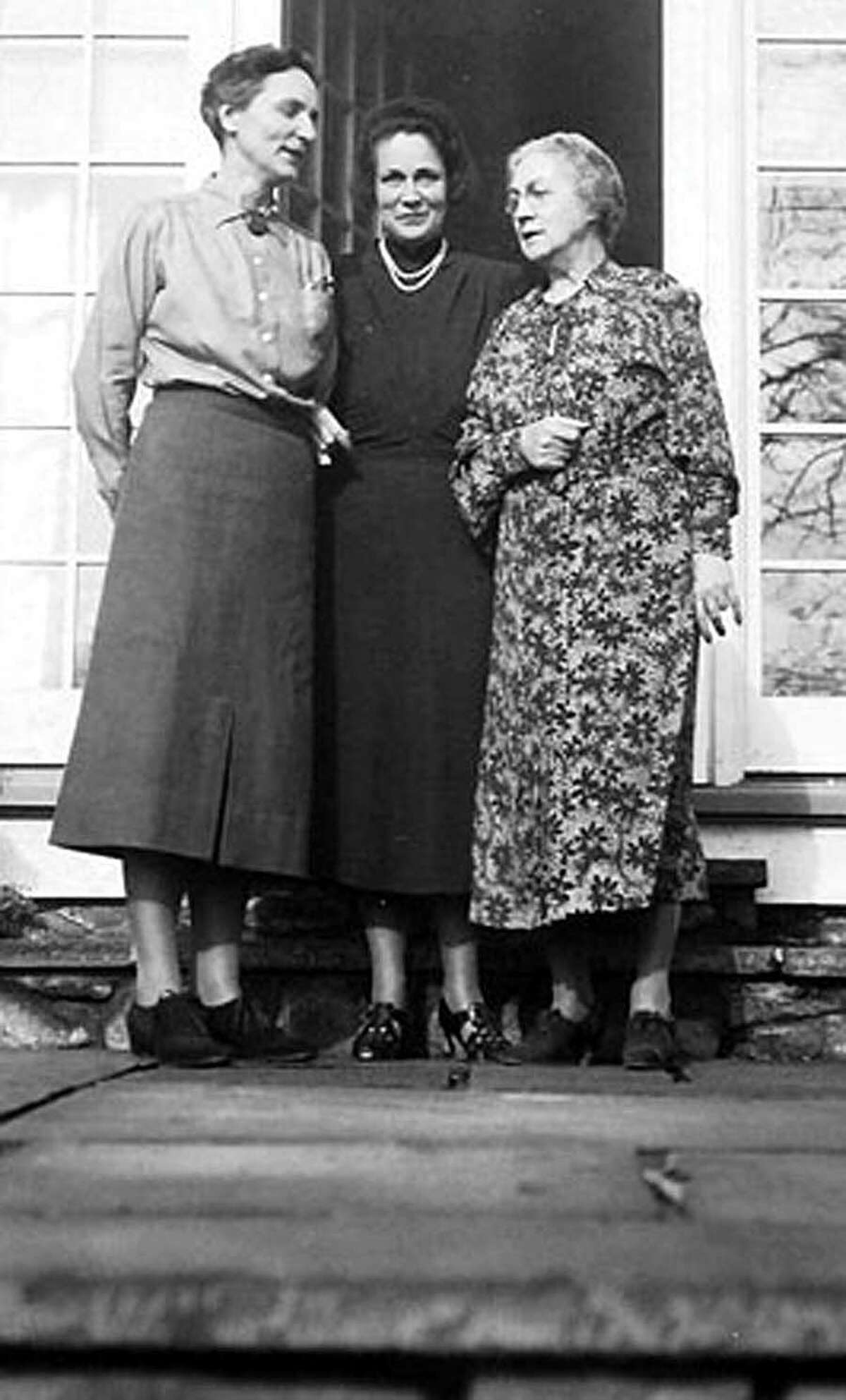 Beatrix Farrand, left, shares a moment at Three Rivers Farm in Bridgewater with Antoinette Peterson, right, wife of farm owner Dr. Frederick Peterson, and an unknown guest.