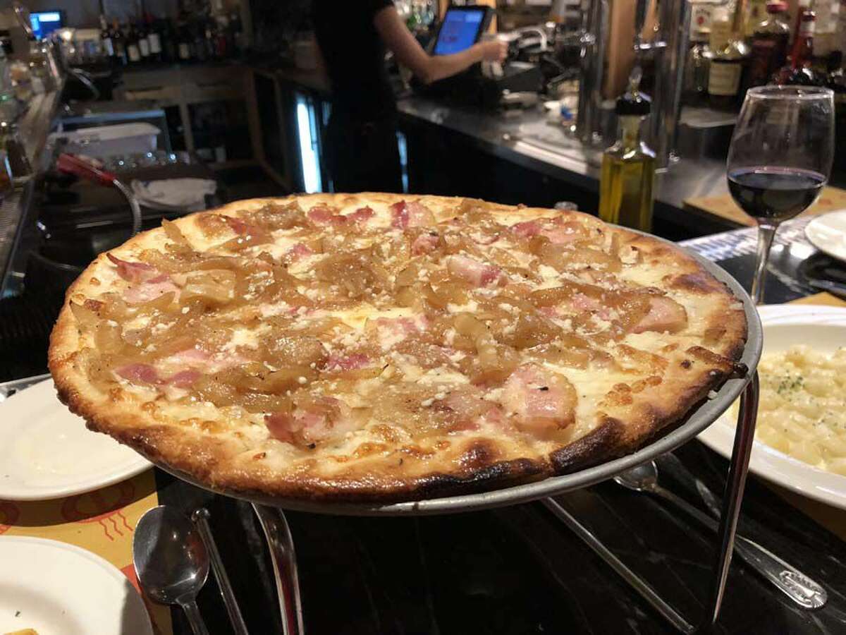 The bianca ala Romana white pizza at Alforno — caramelized onions, European bacon, mozzarella and fresh thyme.