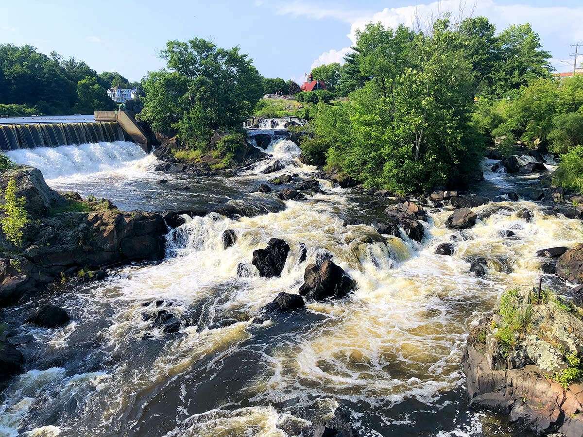The Quinebaug River tumbles over Cargill Falls in the center of Putnam, long the site of a historic textile mill.