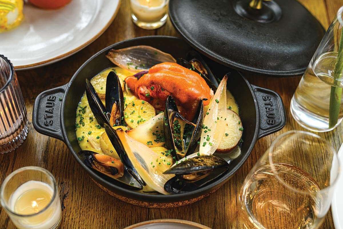 Lobster bake with tomatoes, corn, mussels and smoked paprika hollandaise at Hamilton Park