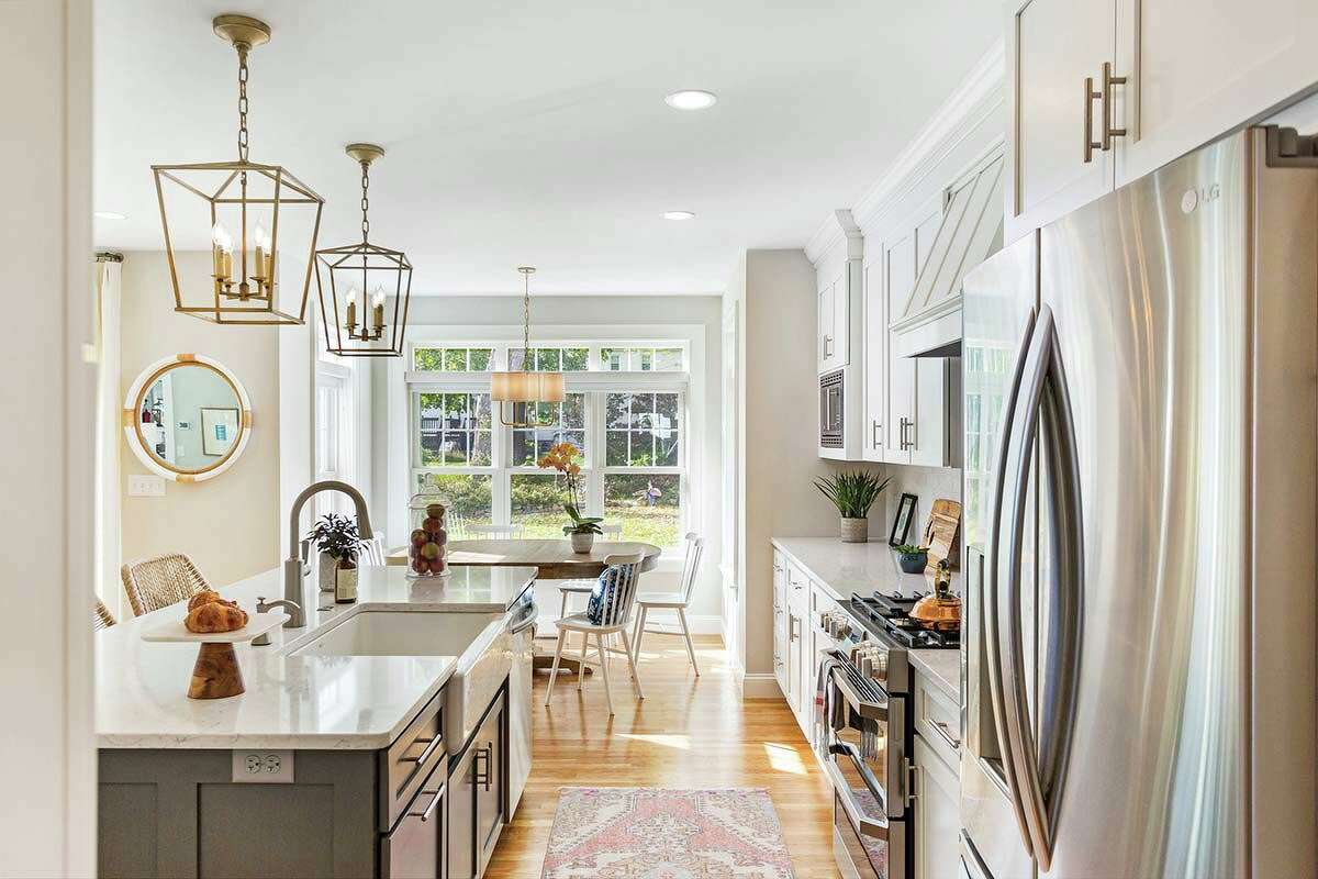 The renovated kitchen has a breakfast nook, which the family didn’t have before. And a kitchen island, with three big counter stools, offers another gathering spot for informal meals.