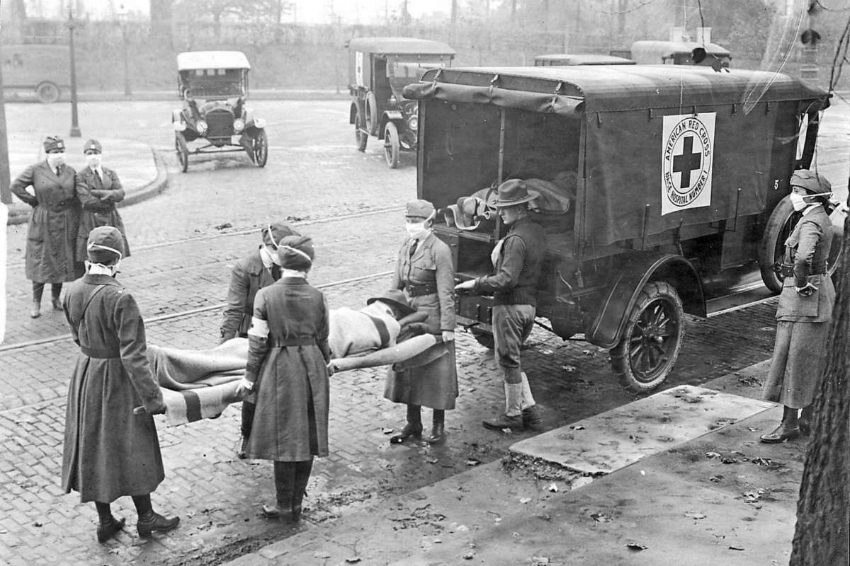 Members of the American Red Cross remove Spanish influenza victims from a house at Etzel and Page avenues in 1918.