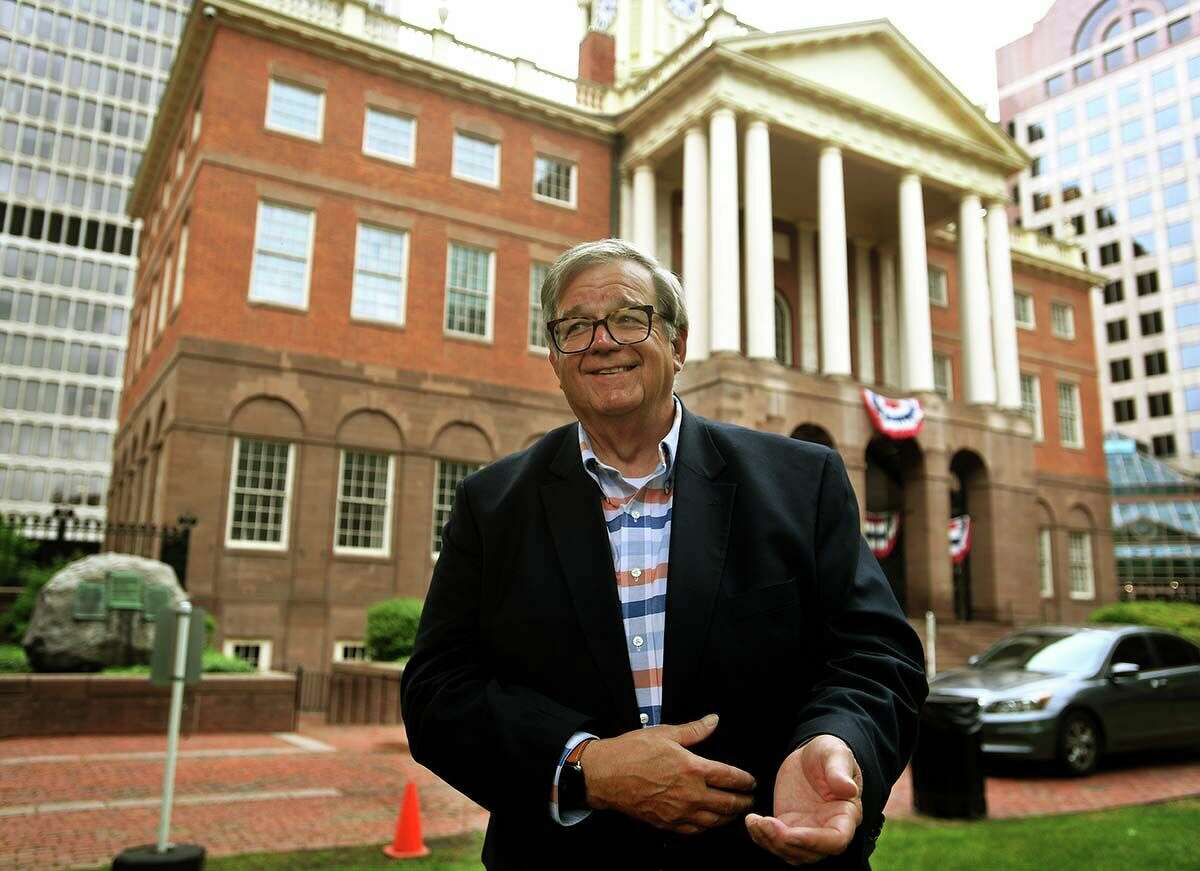 State Historian Walter Woodward outside the Old State House in Hartford. The building was home to all three branches of state government from 1796 until 1887.