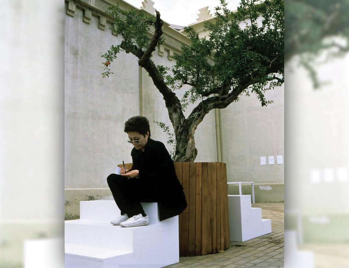 Yoko Ono's "Wish Tree" will be on exhibit at the New Britain Museum of American Art starting in October. Ono is shown here during an installation of one of her Wish Trees in Alicante, Spain, in 1997.