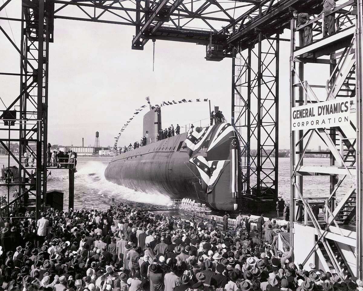 The launch of the world's first nuclear powered submarine, the U.S.S. Nautilus.
