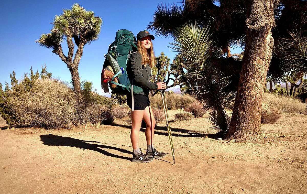 Hannah Bacon hikes on a trail near Joshua Tree National Park in Southern California in the early days of her walk across the country to raise awareness about climate change.