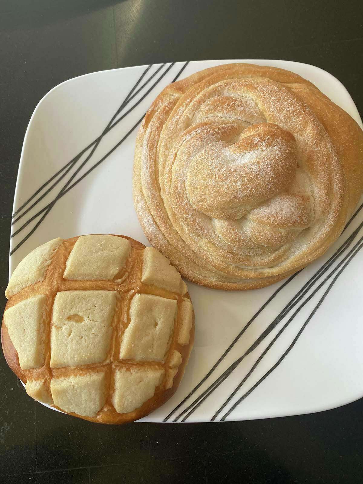 Aurora’s features daily house-baked breads, like pan dulce (left) and campechanas, dusted with sugar.