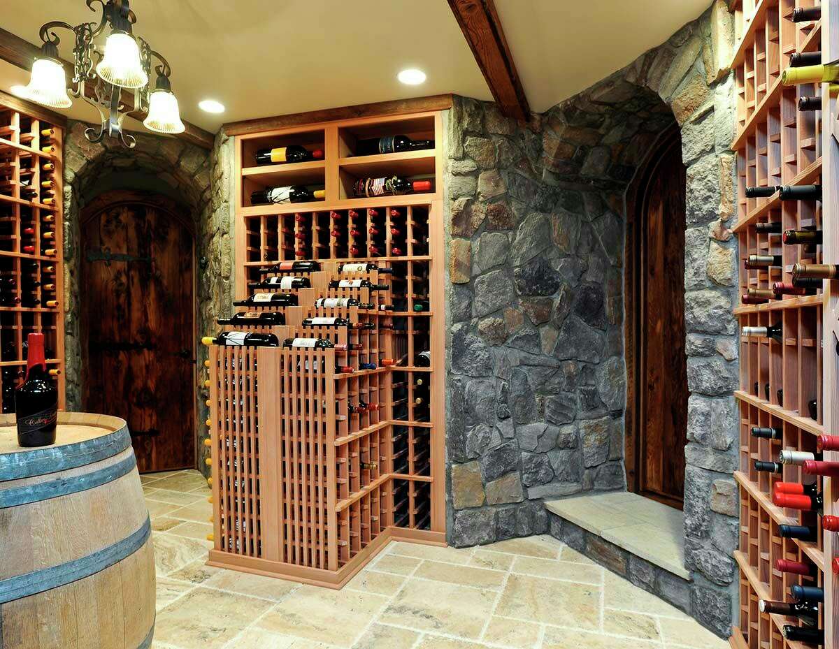 A cascade of bottles in a wine cellar in New Canaan, designed by Fred Tregaskis of Summit Wine Cellars.