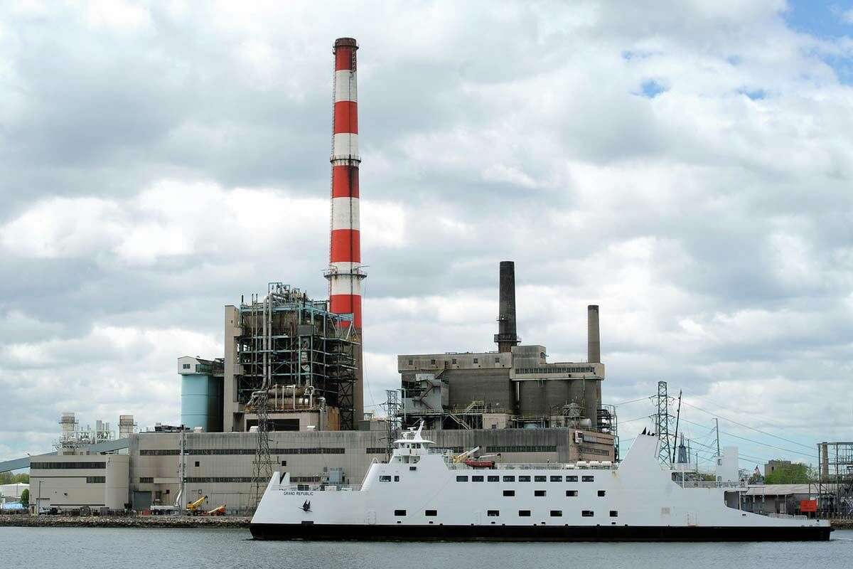The ferryboat Grand Republic motors past PSEG's Bridgeport Harbor Station power plant, on the way out of Bridgeport Harbor, in Bridgeport, Conn. May 15, 2017.
