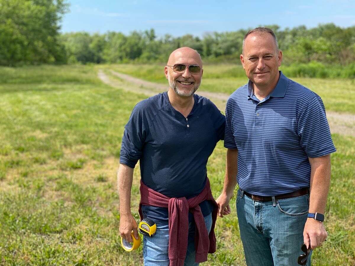 Rob Ruggiero, producing artistic director of TheaterWorks Hartford, and Mike Zaleski, CEO of Riverfront Recapture, at the site of the upcoming Walden outdoor play along the Connecticut River.