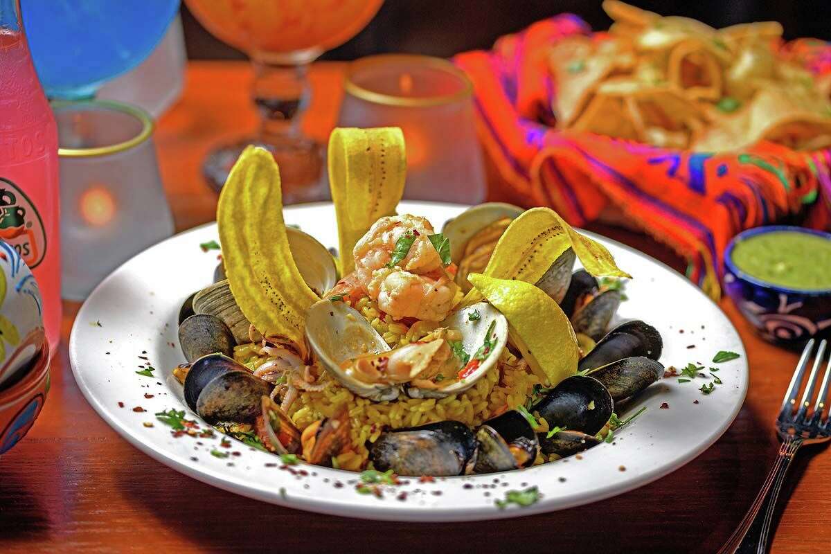 The Paella Mexicana combines shrimp, chorizo, calamari, clams, mussels, chicken, saffron rice and plantain chips.