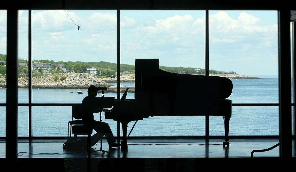 A pianist practices at the Shalin Liu Performance Center