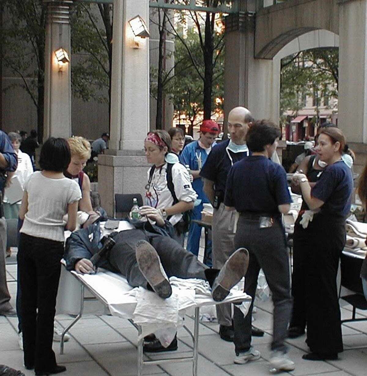 The triage site at the corner of Greenwich and North Moore streets. Dirk Stanley (in blue scrubs and red hat) works on a patient.