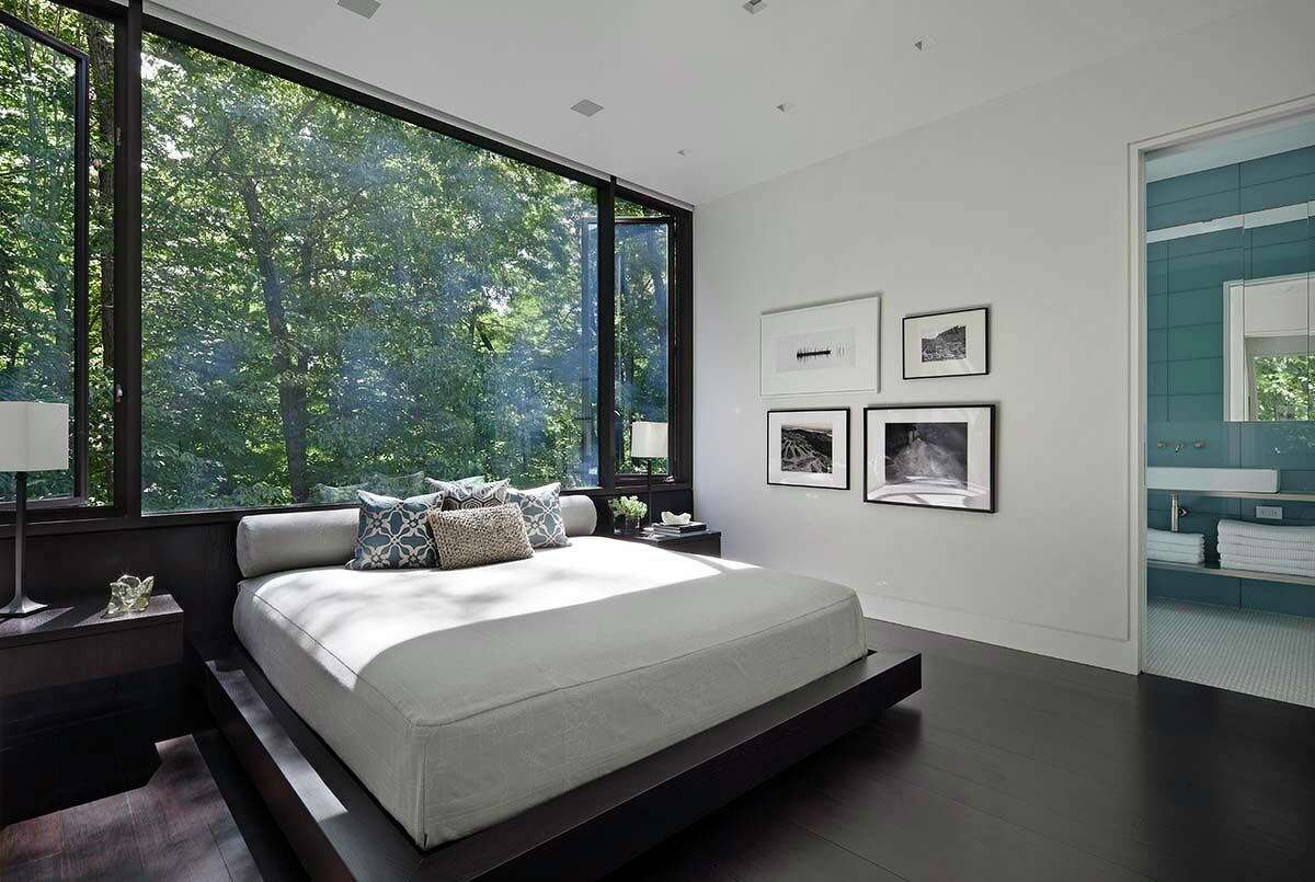 How’s this for a picturesque headboard? With all three bedrooms on the upper level, the residents must feel like they’re sleeping within a tree canopy.