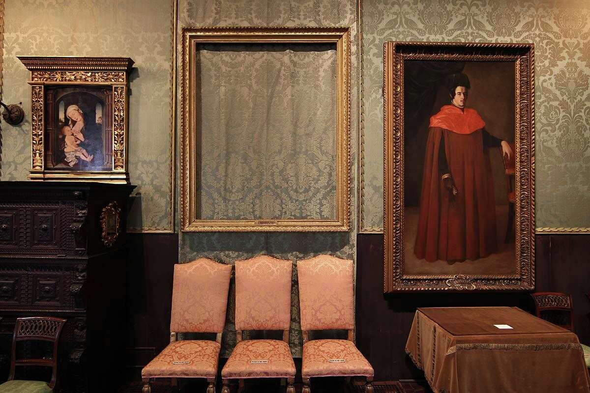 An empty frame hangs in the Isabelle Stewart Gardner Museum, where a painting was stolen in 1990.