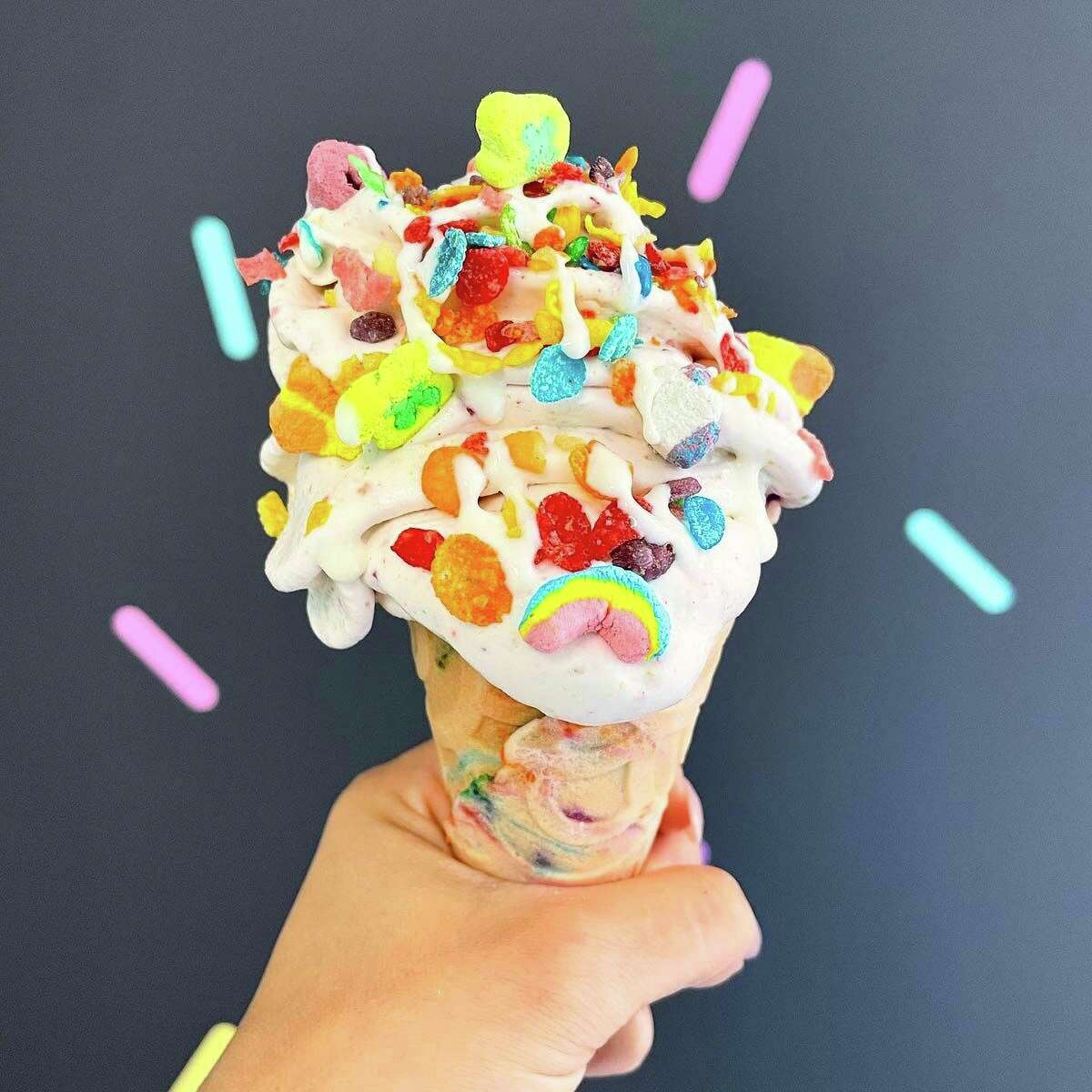 The Rainbow Connection at Sundae Funday, with vanilla ice cream, Fruity Pebbles, Lucky Charms and marshmallow sauce on a birthday cake flavored cone.