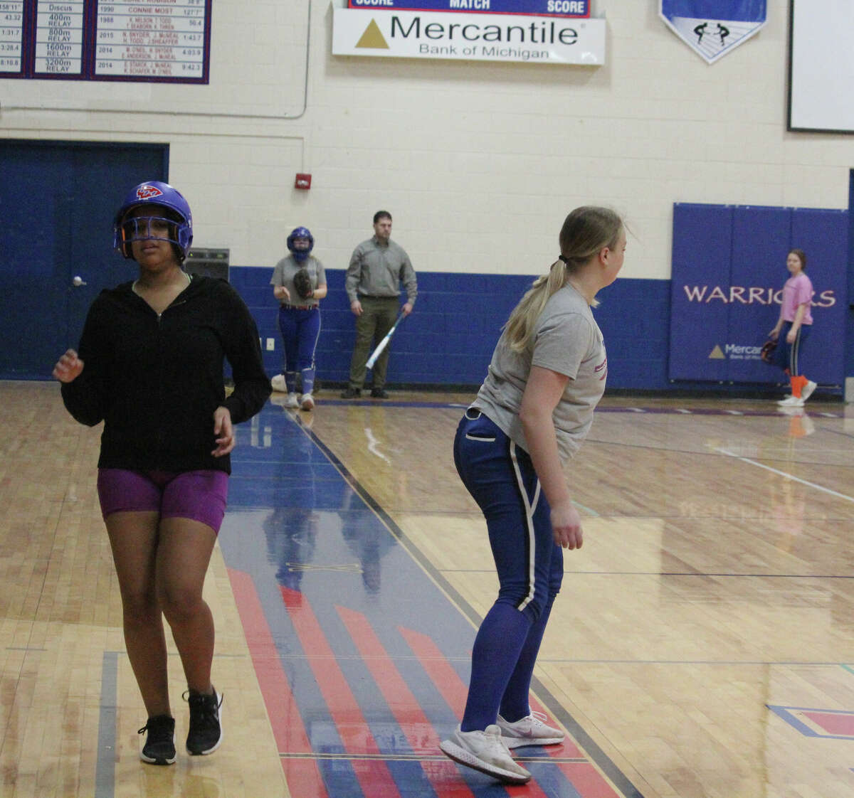 Chippewa Hills softball players work out during a practice in the high school gym last week.