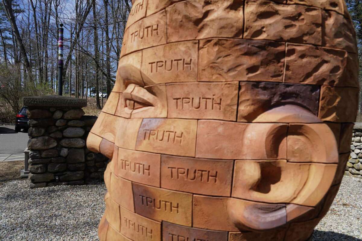 The 300-brick sculpture Brickhead - Truth has arrived early for the New Canaan Land Trust Sculpture Trail, and stands outside the Carriage Barn in Waveny Park in New Canaan. The sculpture by James Tyler was was photographed March 29, 2022.