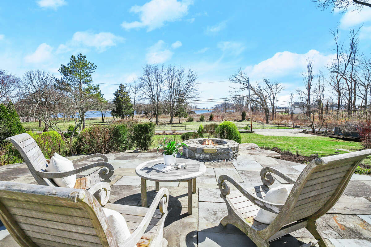 The patio and fire pit off the back of the home on 21 Grove Point Road in Westport, Conn.