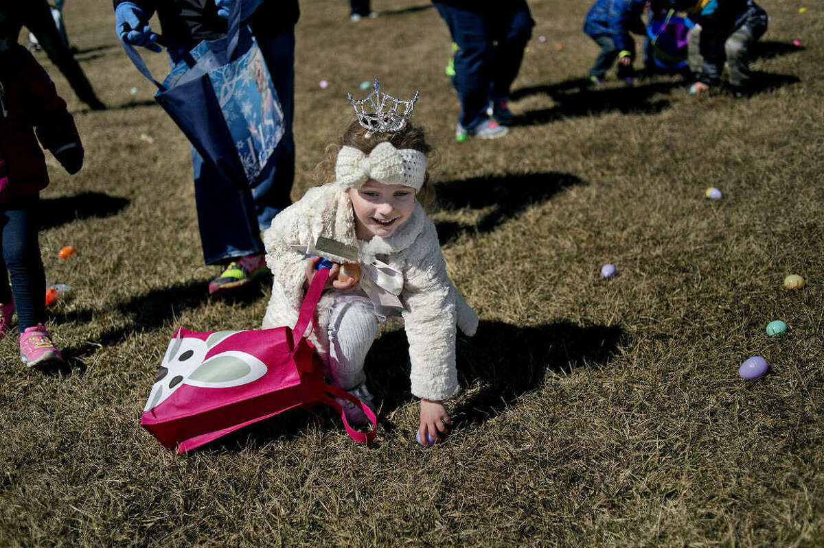 During a 2015 Auburn Jaycees annual Easter egg hunt, Adrianna Hair, then 4, of Bay City, picked up goodies in Auburn City Park.