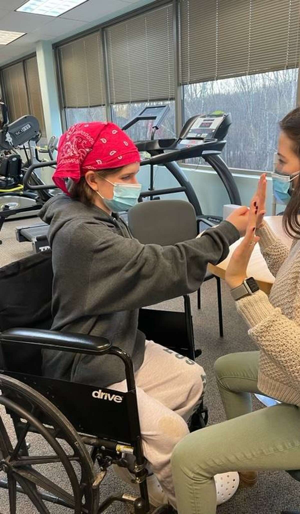 Eva Houlihan during a recent physical therapy session. Houlihan continues to learn how to gain her strength back after the accident last April.