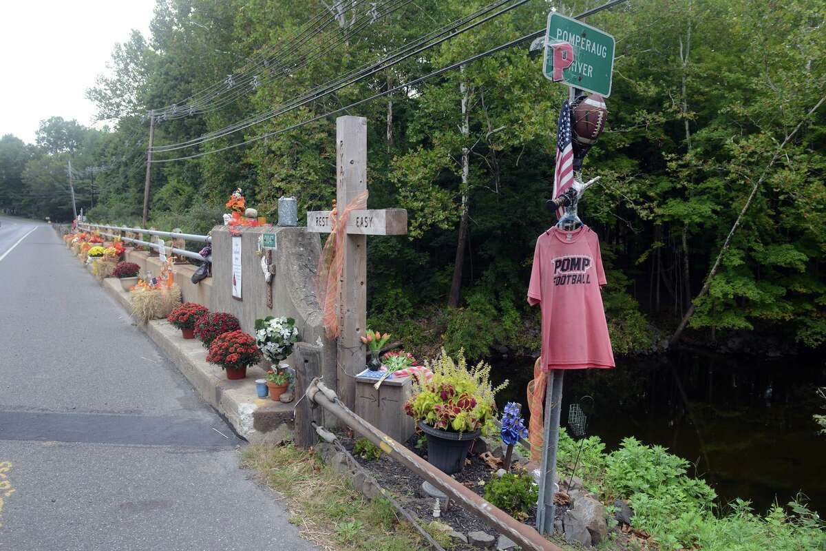 Memorials for Ryan Rutledge are set out on the Rt. 67 bridge over the Pomperaug River, in Southbury, Conn. Sept. 17, 2021. Rutledge, a Pomperaug High School student and athlete, was killed in an automobile accident at the bridge in April.